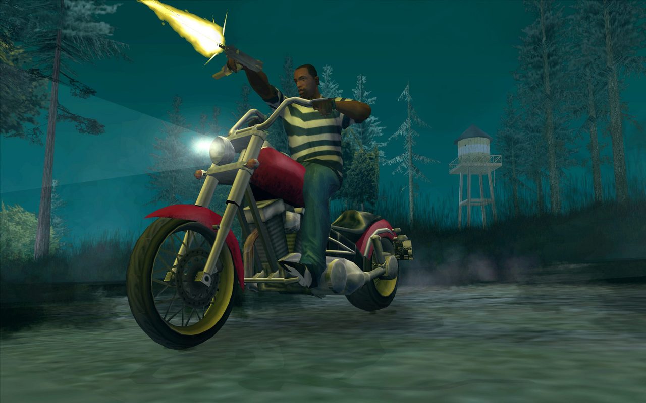 CJ riding a motorcycle and firing a gun at night in the Whetstone countryside in Grand Theft Auto: San Andreas