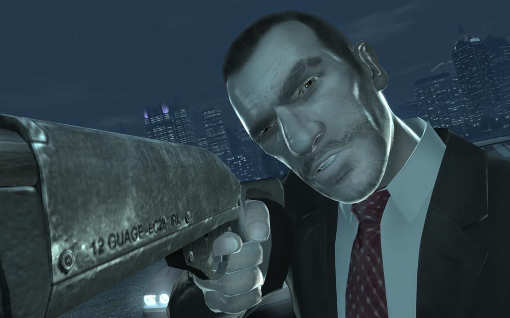 Close-up of Niko Bellic holding a gun at night in Liberty City in GTA IV